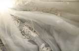 Princess one-shoulder palace irregular pleated lace hemming handmade flower pieces beaded floor-length wedding dress HZ1022